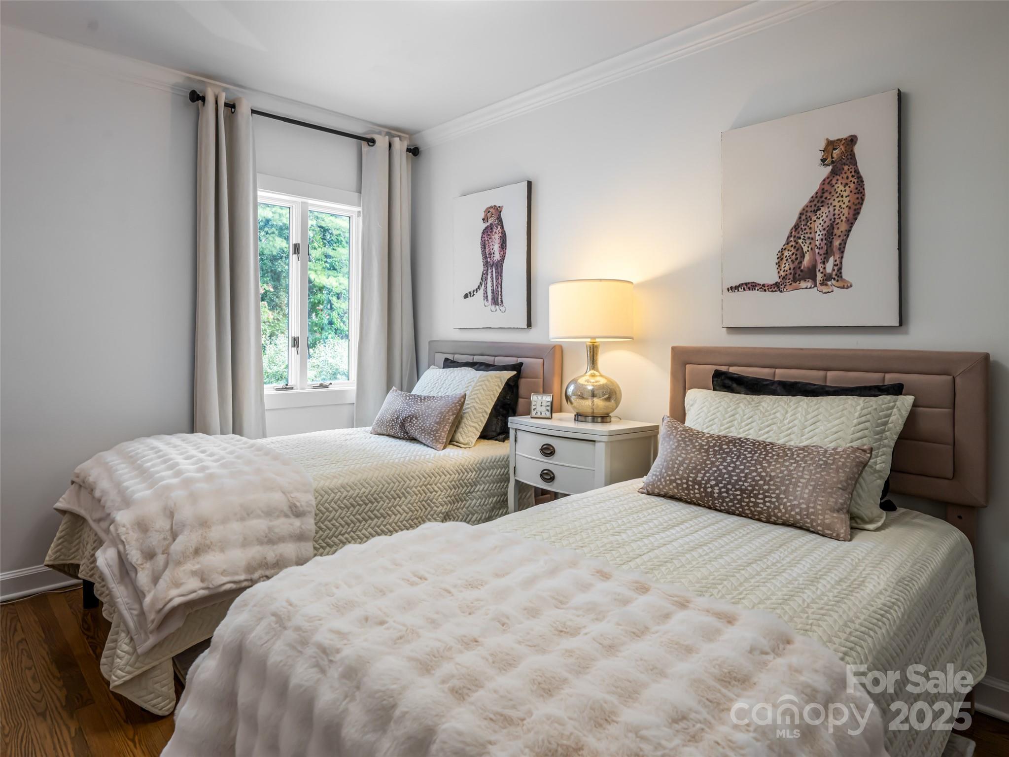 5 Busbee Road Asheville, NC 28803 - Photo 33 of 48 a bedroom with double bed and a window