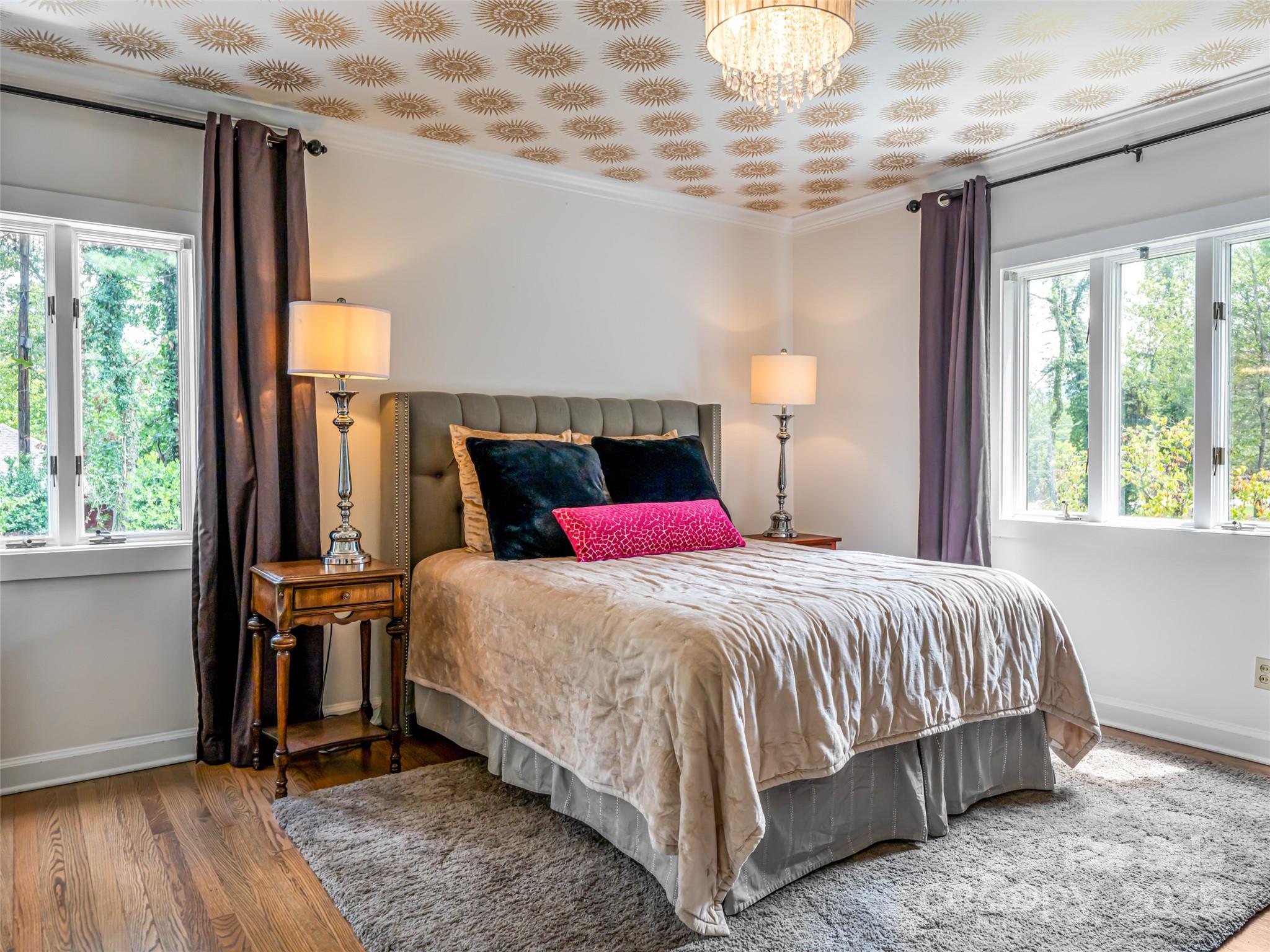5 Busbee Road Asheville, NC 28803 - Photo 35 of 48 a bedroom with a large bed and a window