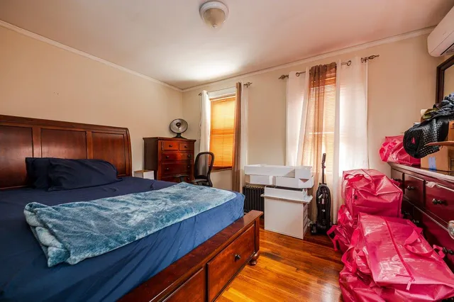 a bedroom with a bed and furniture