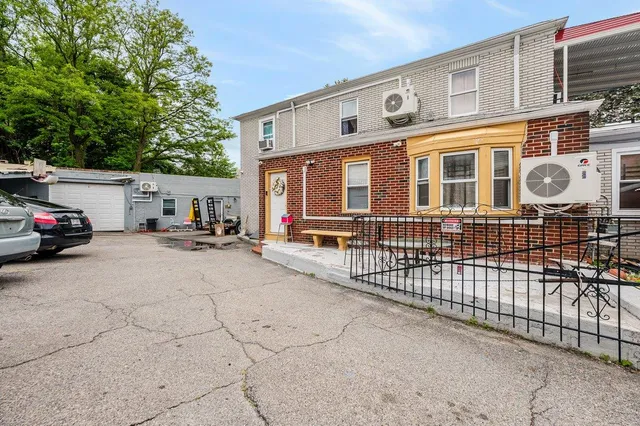 a front view of a building with many windows