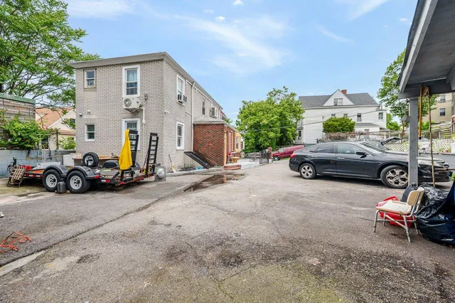 a view of car parked in front of a house