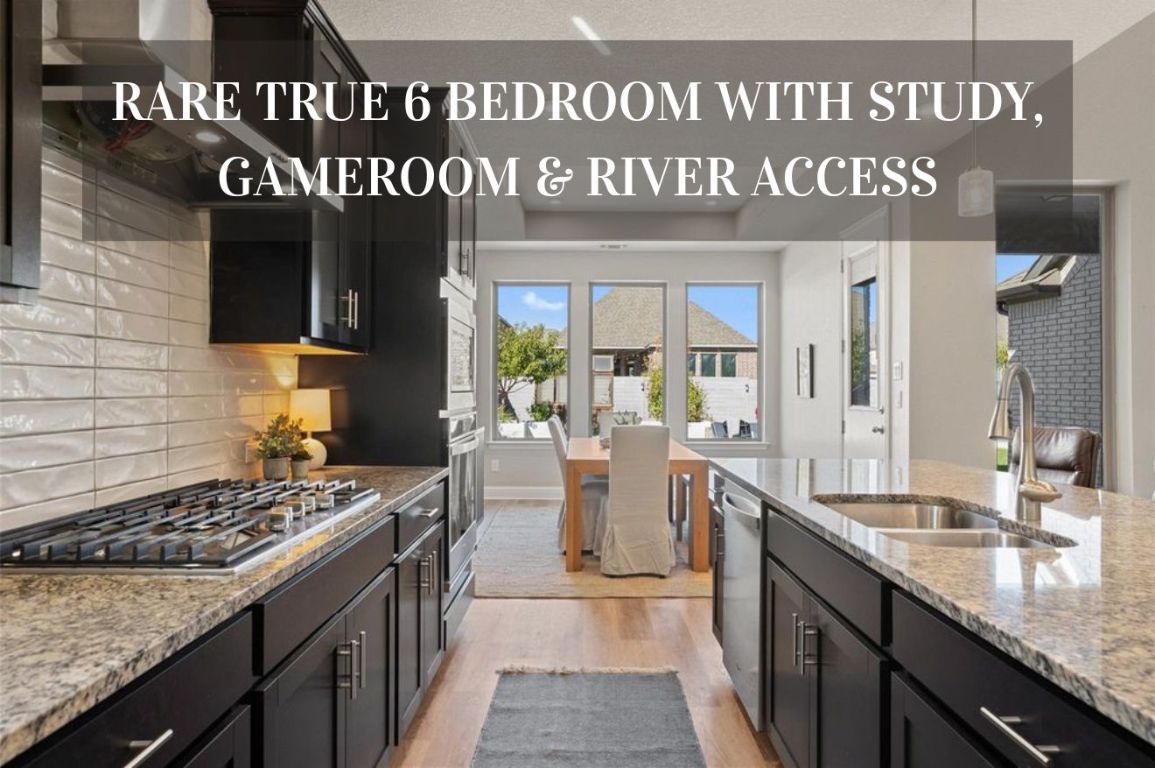 a kitchen with kitchen island granite countertop a stove top oven
