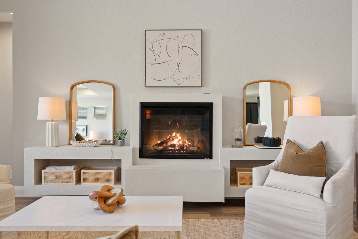 1017 Highcrest Georgetown, TX 78628 - Photo 17 of 40 a living room with furniture a fireplace and a flat screen tv