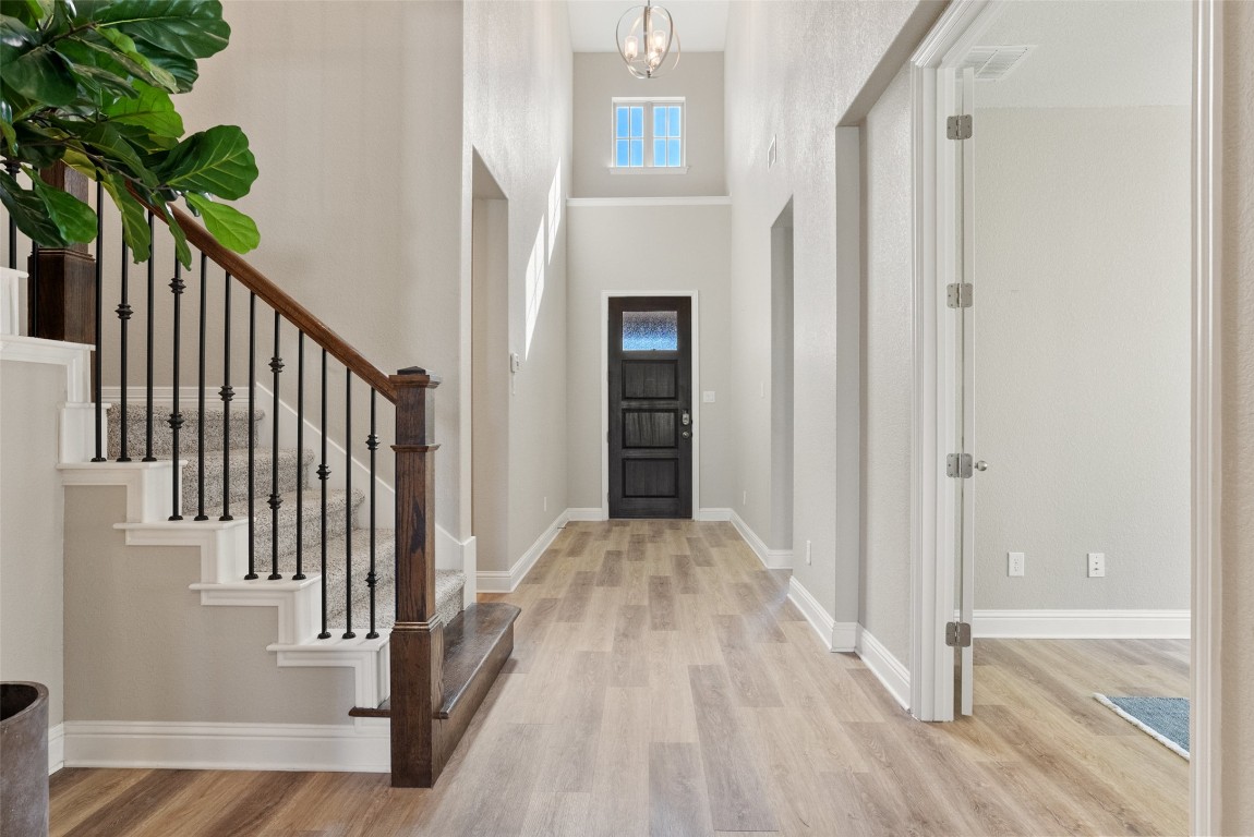 1017 Highcrest Georgetown, TX 78628 - Photo 18 of 40 a view of a hallway with wooden floor and staircase