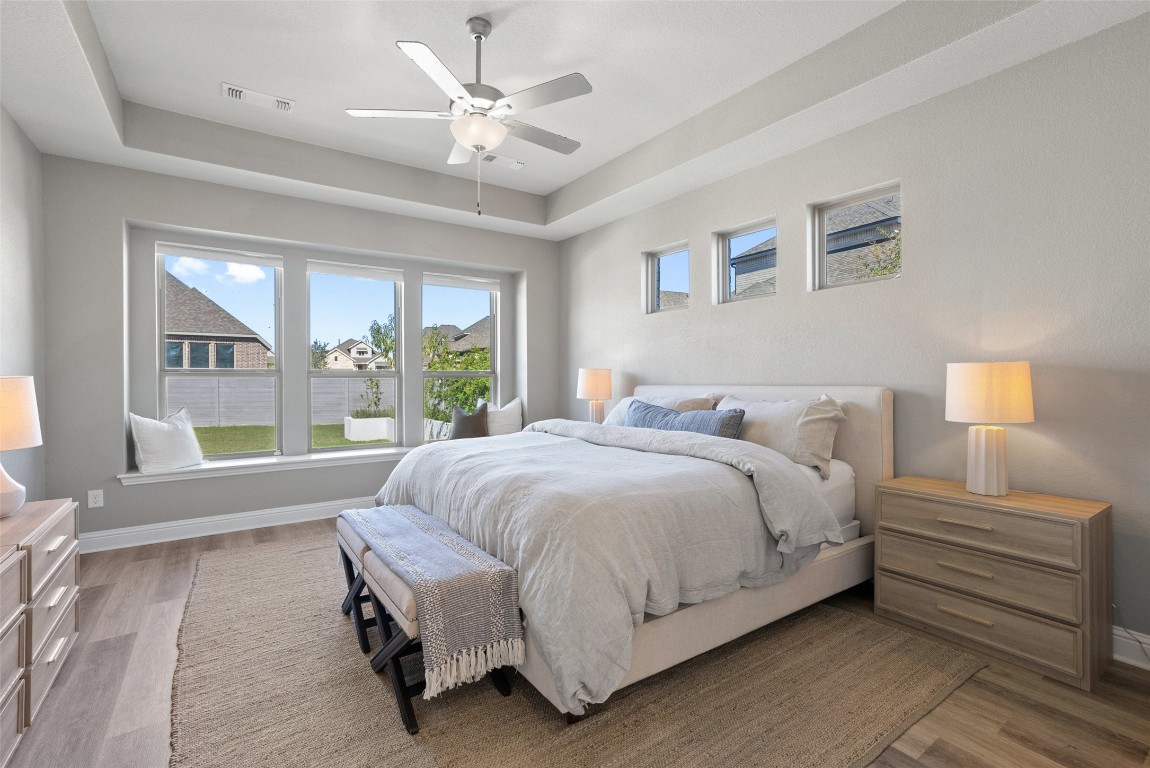 1017 Highcrest Georgetown, TX 78628 - Photo 19 of 40 a spacious bedroom with a bed and a large window