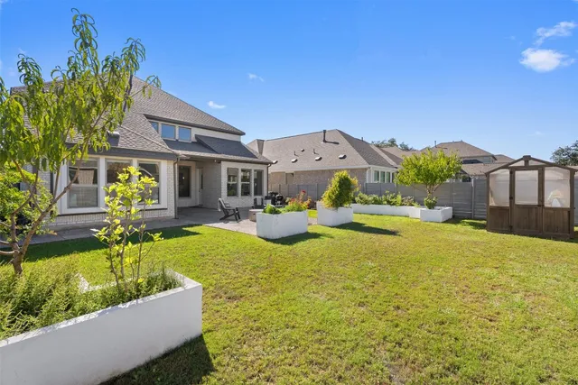 a view of house with swimming pool outdoor seating