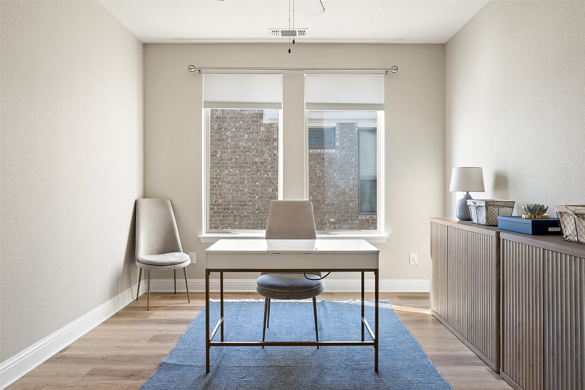1017 Highcrest Georgetown, TX 78628 - Photo 25 of 40 a view of a workspace with furniture and a window