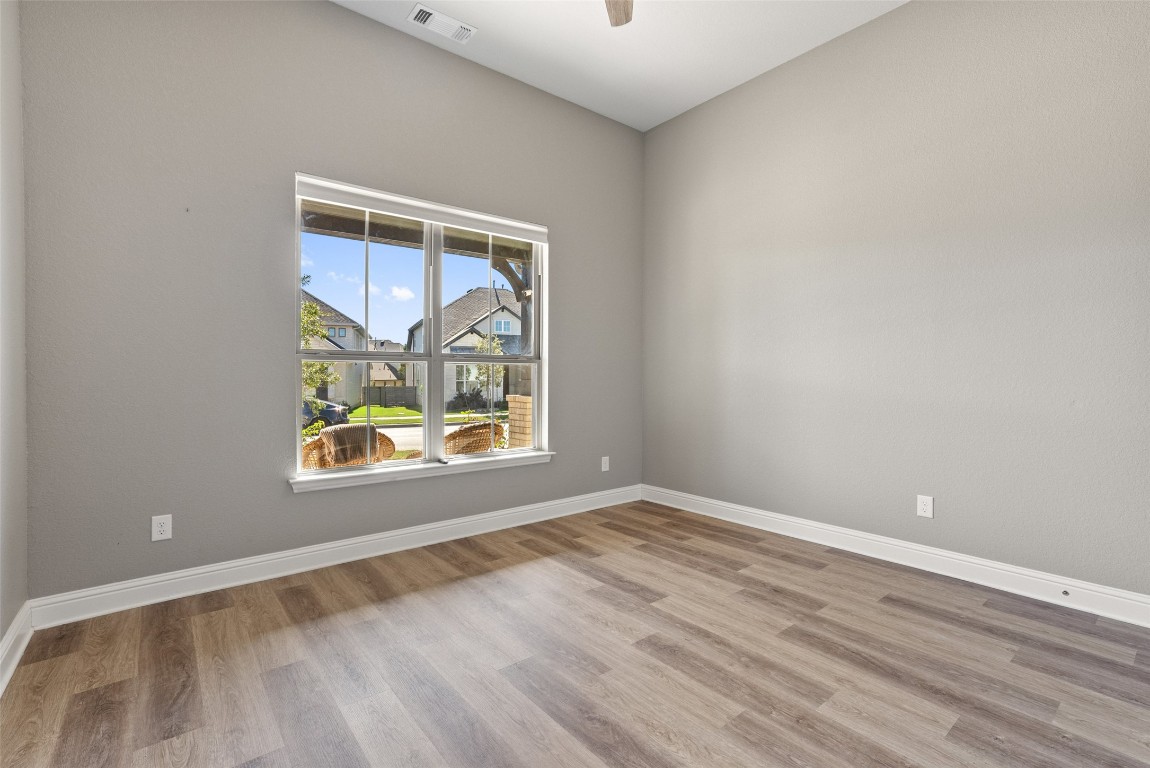 1017 Highcrest Georgetown, TX 78628 - Photo 26 of 40 an empty room with wooden floor and windows