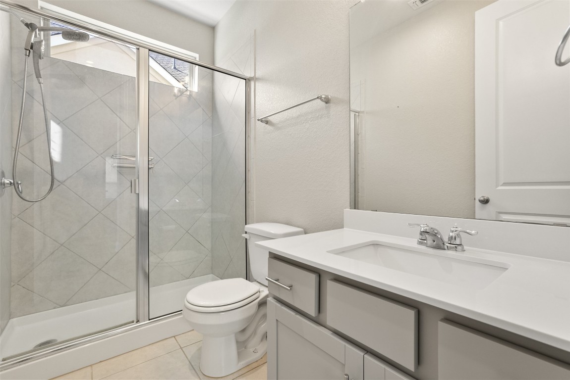 1017 Highcrest Georgetown, TX 78628 - Photo 27 of 40 a bathroom with a sink a toilet and shower
