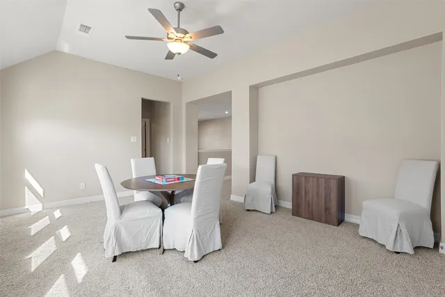 wooden floor with white walls and cabinets