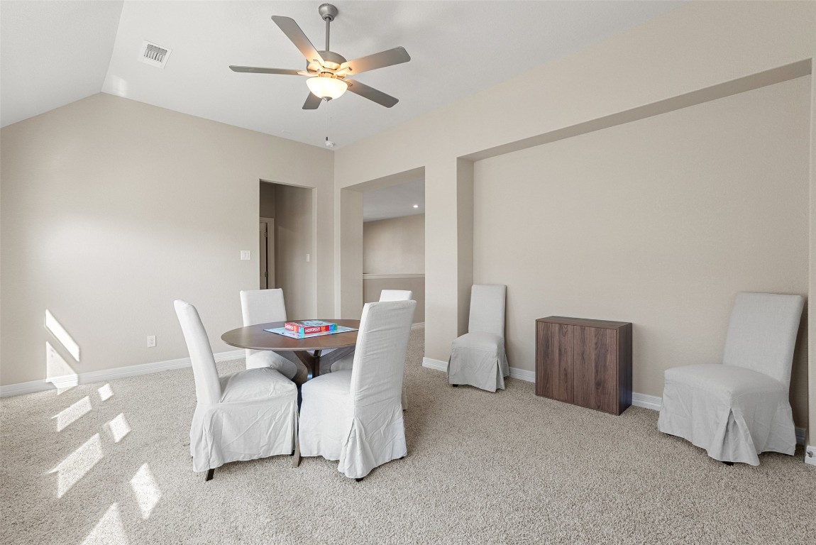 1017 Highcrest Georgetown, TX 78628 - Photo 29 of 40 a living room with furniture a ceiling fan and a rug
