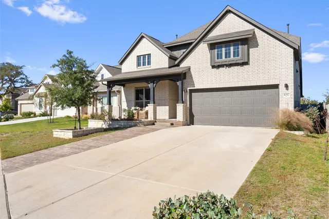 a view of a house with outdoor space and sitting area