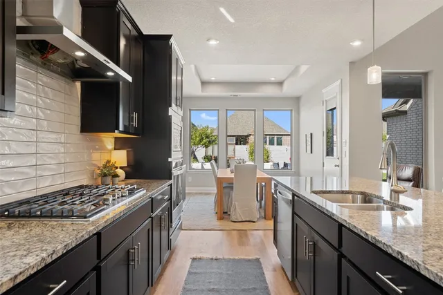 a living room with furniture kitchen and kitchen view