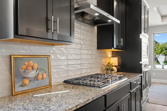 a kitchen with a stove and a sink