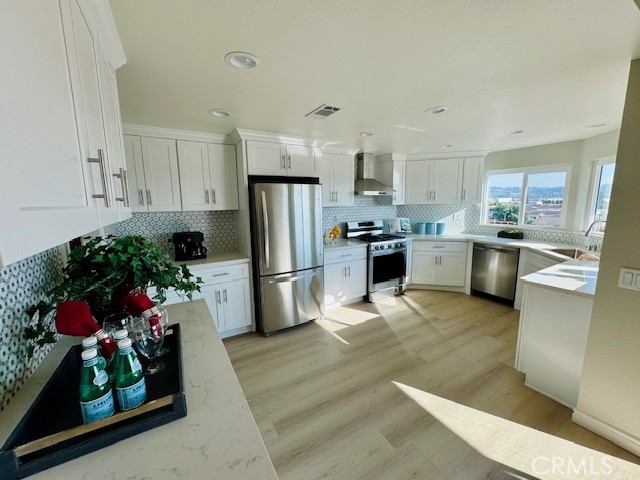 194 Amberwood Drive Walnut, CA 91789 - Photo 11 of 63 a kitchen with a refrigerator and a stove top oven