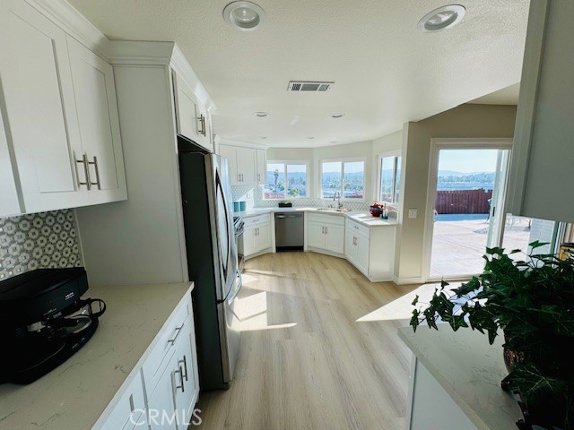 194 Amberwood Drive Walnut, CA 91789 - Photo 12 of 63 a kitchen with a sink stainless steel appliances and cabinets
