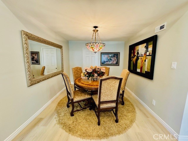 194 Amberwood Drive Walnut, CA 91789 - Photo 13 of 63 a dining room with furniture a rug and a chandelier