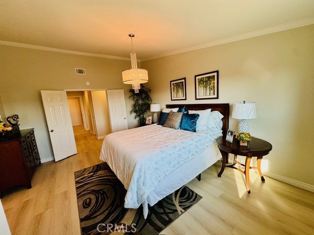 194 Amberwood Drive Walnut, CA 91789 - Photo 17 of 63 a bedroom with a bed and a chandelier