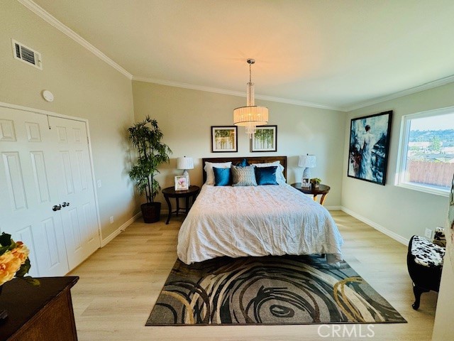 194 Amberwood Drive Walnut, CA 91789 - Photo 18 of 63 a bedroom with a bed and a chandelier
