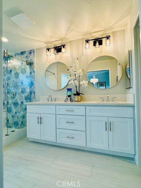 194 Amberwood Drive Walnut, CA 91789 - Photo 22 of 63 a bathroom with a double vanity sink and a mirror