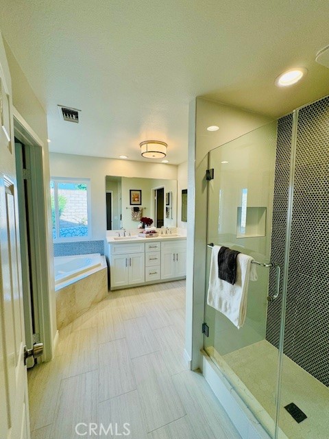 194 Amberwood Drive Walnut, CA 91789 - Photo 30 of 63 a view of a bathroom with a tub shower and mirror