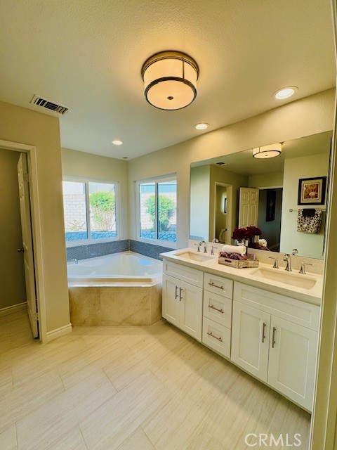 194 Amberwood Drive Walnut, CA 91789 - Photo 31 of 63 a large bathroom with a large tub and sink