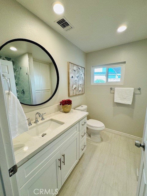 194 Amberwood Drive Walnut, CA 91789 - Photo 37 of 63 a bathroom with a toilet a sink and a mirror
