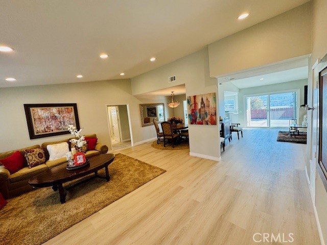 194 Amberwood Drive Walnut, CA 91789 - Photo 6 of 63 a living room with furniture and a dining table with wooden floor