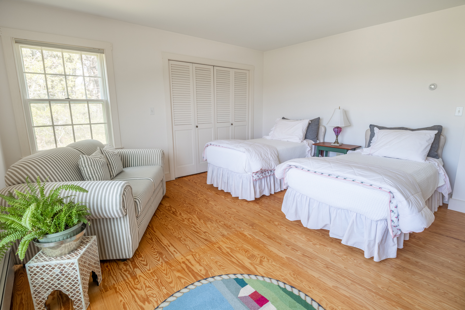 15 Swift Rock Road Nantucket, MA 02554 - Photo 15 of 32 a bedroom with two beds and a potted plant