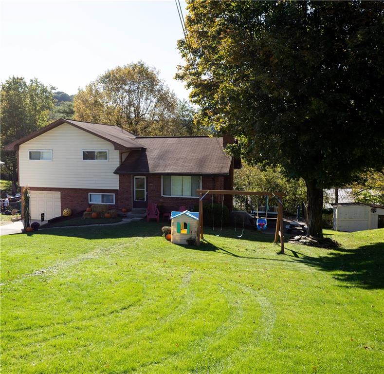 133 Church Road Pittsburgh, PA 15209 - Photo 2 of 20 a view of a house with a yard patio and fire pit