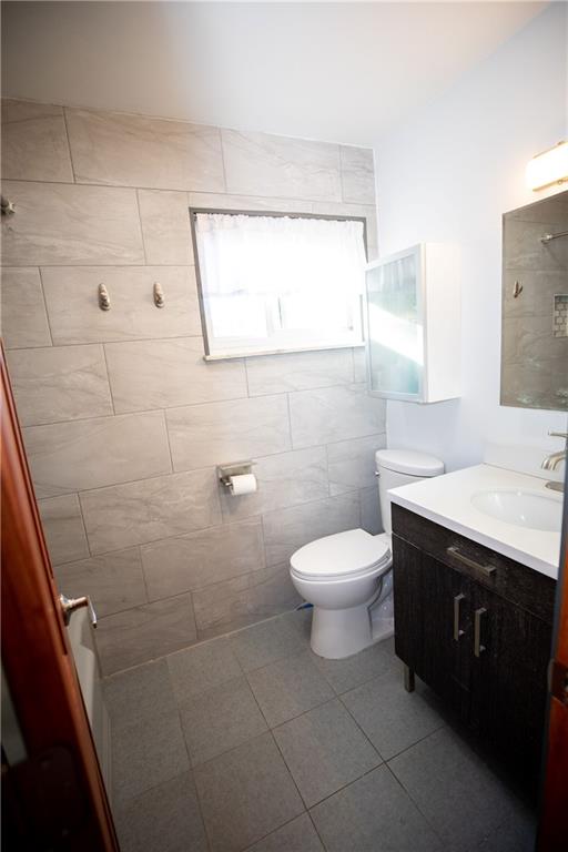 133 Church Road Pittsburgh, PA 15209 - Photo 11 of 20 a bathroom with a toilet sink and mirror