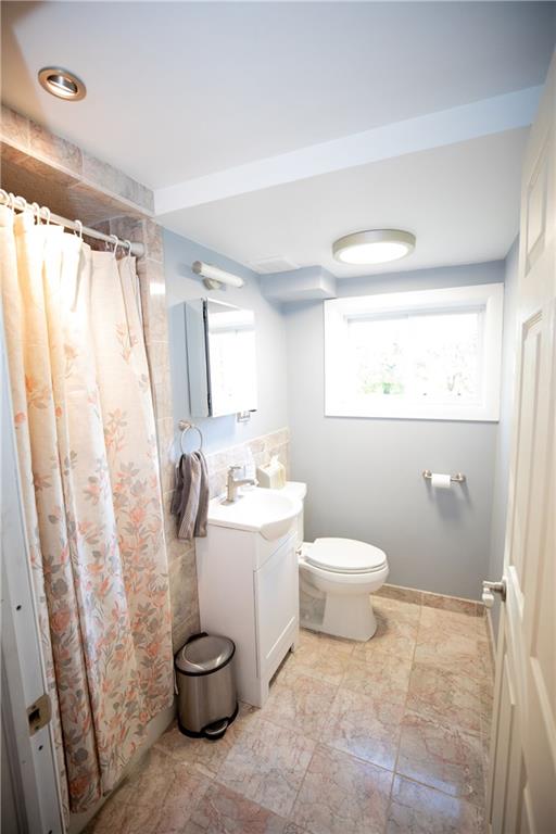133 Church Road Pittsburgh, PA 15209 - Photo 13 of 20 a bathroom with a toilet a sink and a shower