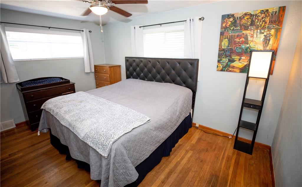133 Church Road Pittsburgh, PA 15209 - Photo 14 of 20 a bedroom with a bed and wooden floor