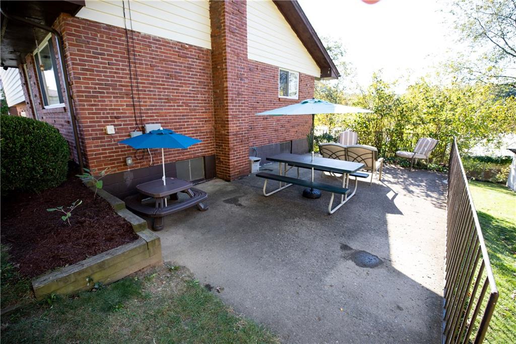 133 Church Road Pittsburgh, PA 15209 - Photo 4 of 20 a view of a backyard with chairs and a patio