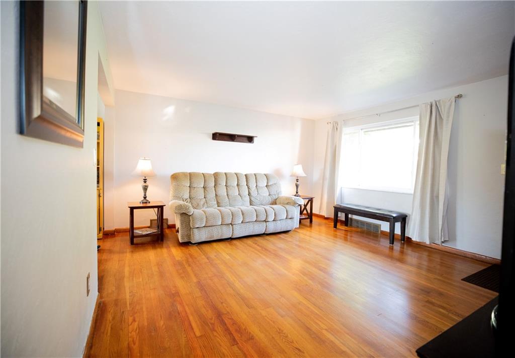 133 Church Road Pittsburgh, PA 15209 - Photo 6 of 20 a living room with a couch and a window