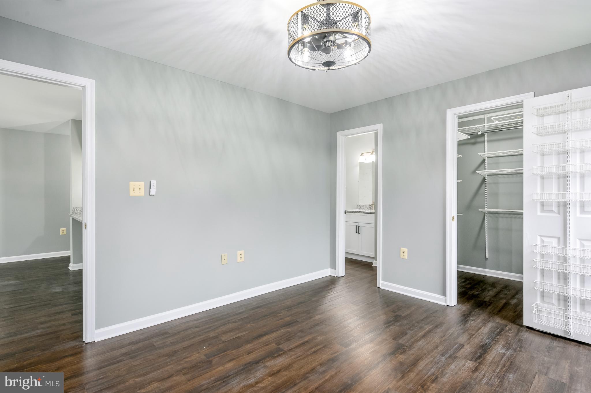 21012 Timber Ridge Terrace, Unit 101 Ashburn, VA 20147 - Photo 15 of 29 Primary Bedroom,