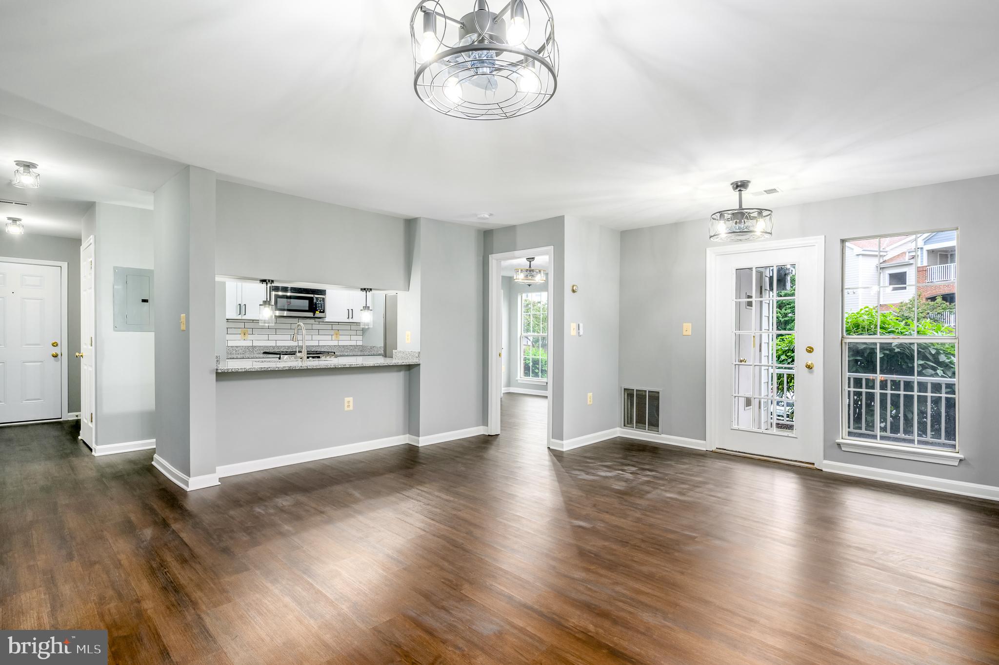 21012 Timber Ridge Terrace, Unit 101 Ashburn, VA 20147 - Photo 5 of 29 Living Room / Dining Room