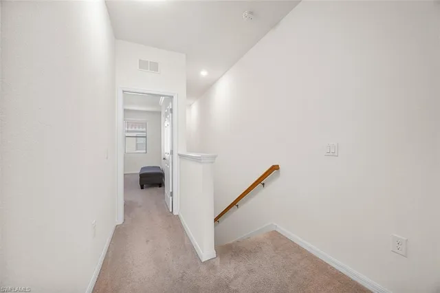 a view of a hallway with a white walls