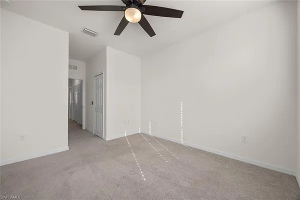 an empty room with fan