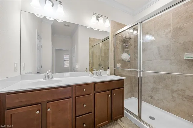 a bathroom with a double vanity sink mirror and double