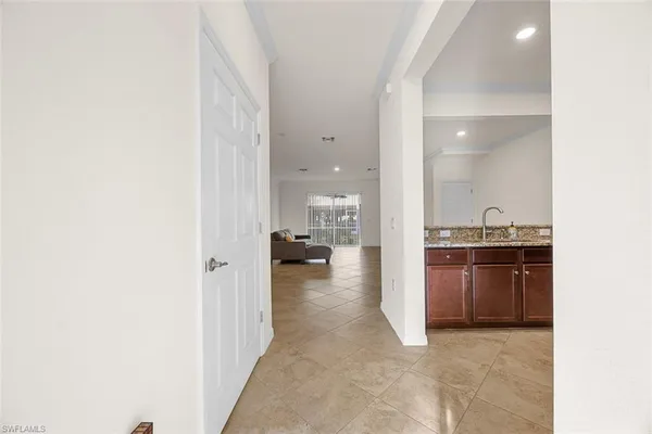 a view of a kitchen from the hallway
