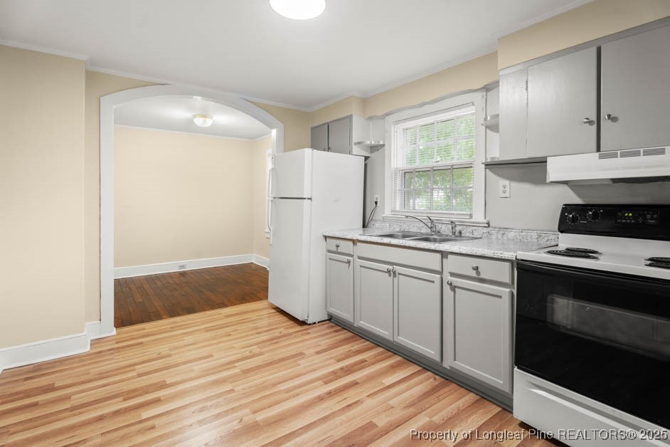 1007 Jenkins Street Lumberton, NC 28358 - Photo 14 of 44 a kitchen with a sink stove and refrigerator
