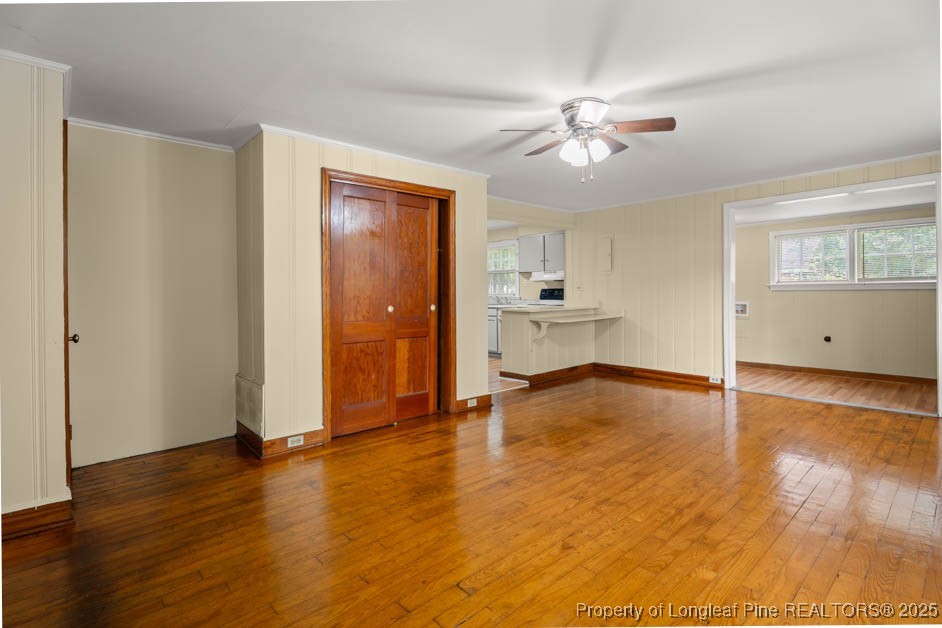 1007 Jenkins Street Lumberton, NC 28358 - Photo 19 of 44 a view of empty room with wooden floor and fan