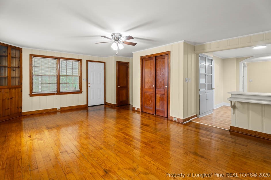 1007 Jenkins Street Lumberton, NC 28358 - Photo 20 of 44 a view of an empty room with window and wooden floor