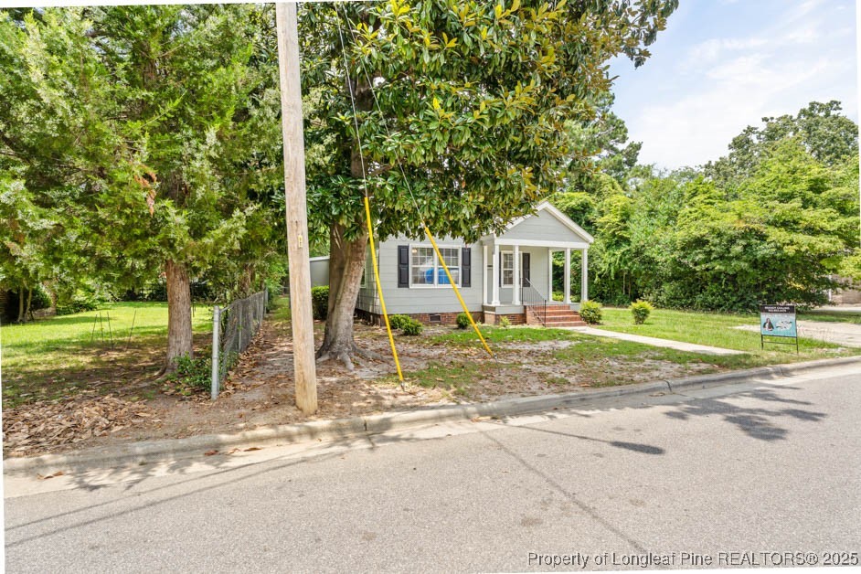 1007 Jenkins Street Lumberton, NC 28358 - Photo 2 of 44 a front view of a house with a yard