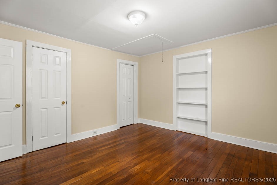 1007 Jenkins Street Lumberton, NC 28358 - Photo 26 of 44 a view of wooden floor and windows in a room