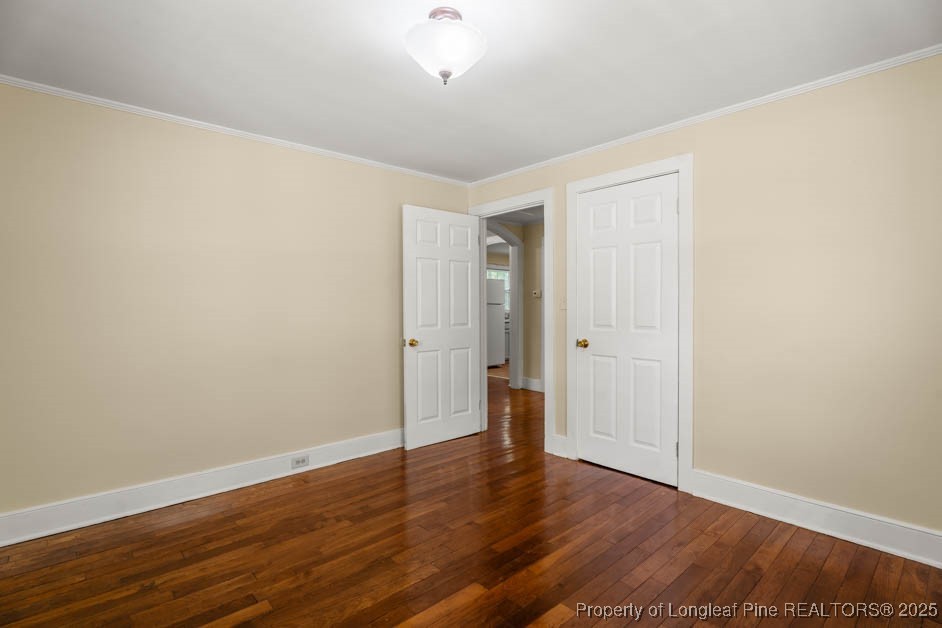1007 Jenkins Street Lumberton, NC 28358 - Photo 35 of 44 a view of an empty room with wooden floor