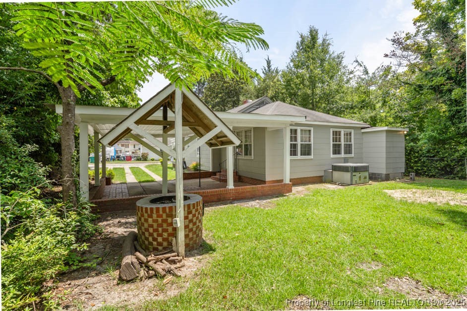 1007 Jenkins Street Lumberton, NC 28358 - Photo 39 of 44 a front view of a house with yard and green space