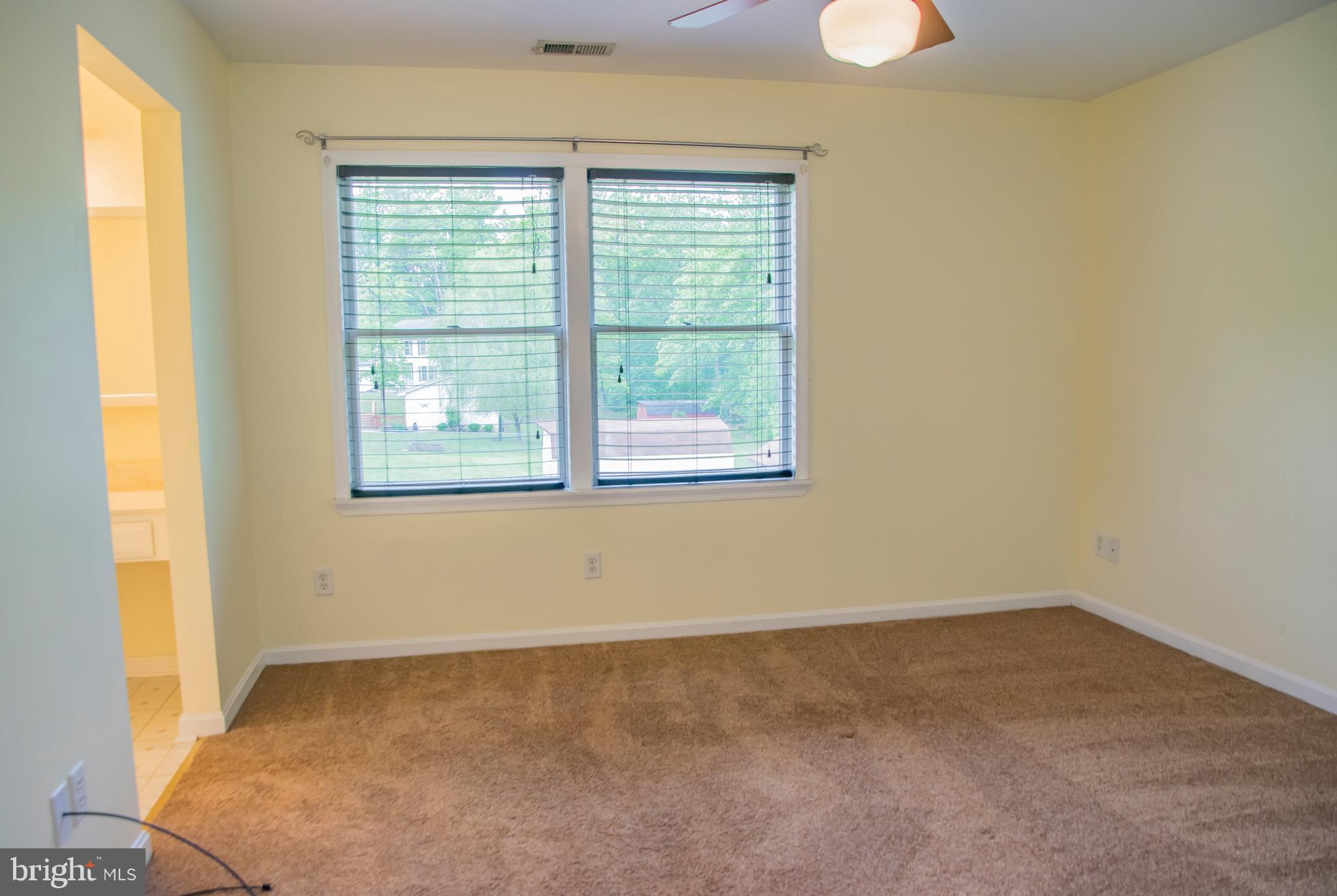 1403 Spring Avenue Baltimore, MD 21237 - Photo 12 of 28 an empty room with a window