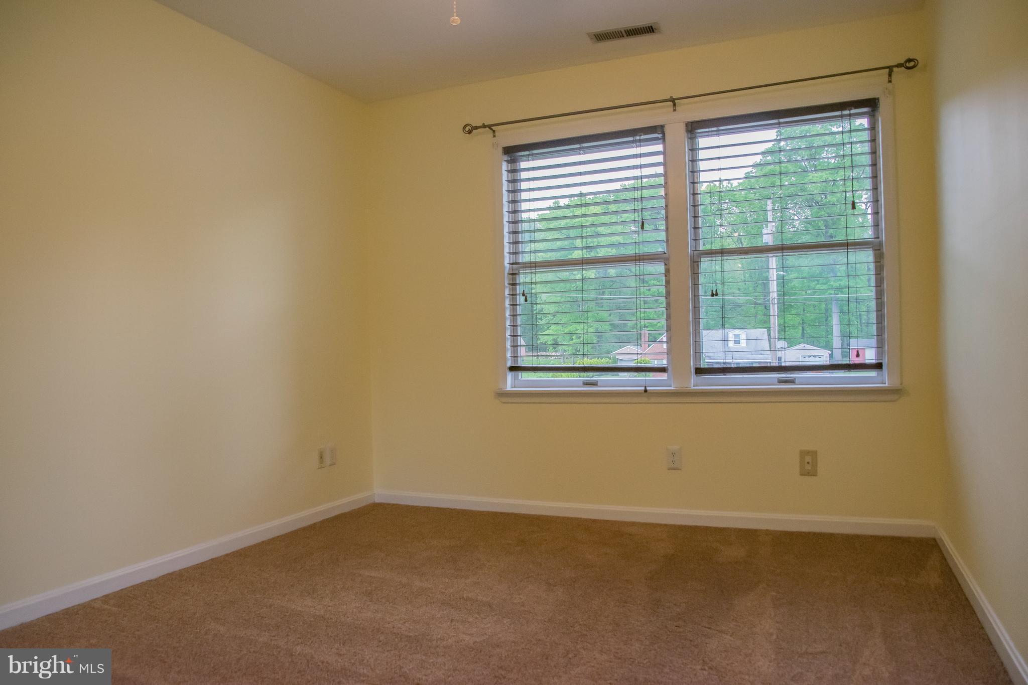 1403 Spring Avenue Baltimore, MD 21237 - Photo 15 of 28 an empty room with a window